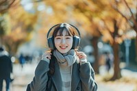 Japanese student listening music headphones portrait headset.