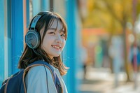 Korean student listening music headphones headset school.
