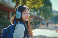Taiwanese student listening music headphones headset architecture.