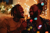 African American gay couple laughing smiling light.