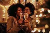 African American lesbian couple drink champagne drinking.