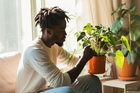 African American man plant sitting adult.