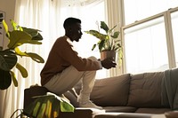 African American man plant sitting adult.