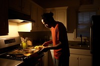 African American man kitchen food appliance.