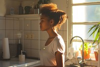 African American young woman contemplation architecture hairstyle.