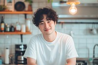 Korean male smiling kitchen t-shirt.