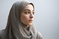 Middle eastern teen woman in abaya and hijab portrait looking adult.