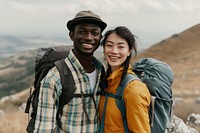Mixed race couple with backpack outdoors nature backpacking.
