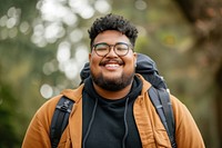 Plus size mixed race teen outdoors smiling glasses.