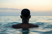 African American man swimming outdoors sports.