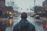 African American man street city rain.