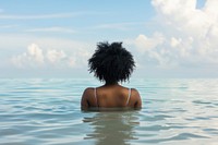 African American woman swimming adult back.