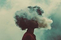 African American woman smoking smoke cloud.