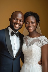 African couple in wedding portrait tuxedo dress.