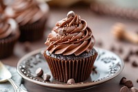 Chocolate cupcake on dish dessert muffin cream.