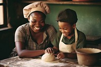 African mom and son making child hat.
