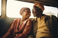 African mid-ages couple standing in bus photography portrait glasses.