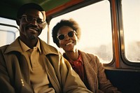 African mid-ages couple standing in bus photography sunglasses portrait.