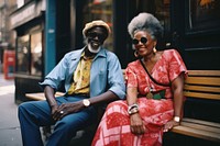 African senior couple portrait glasses sitting.