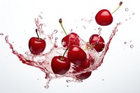 Cherry floating with splash falling fruit plant.
