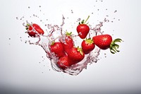 Strawberry floating with splash falling fruit plant.