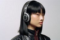 Asian woman wearing headphone listening to music headphones photography portrait.