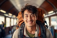 Happy Korean man portrait backpack travel.