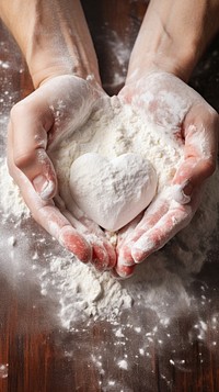  Hands creating heart shapes with flour while baking kitchen ingredient freshness. AI generated Image by rawpixel.