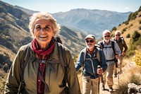 Senior hiking group trekking through picturesque mountains recreation adventure backpack. AI generated Image by rawpixel.