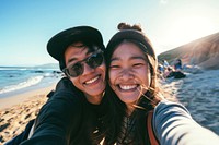 Asian couple selfie at the beach sunglasses laughing portrait.