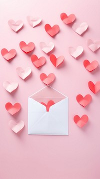  Opened envelope with paper hearts out of it celebration letter symbol. AI generated Image by rawpixel.
