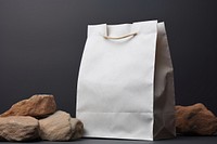 Brown paper bag packaging  gray handbag crumpled paper.