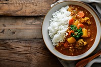 A dish of japanese curry rice on a clean table plate food meal. AI generated Image by rawpixel.