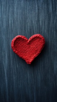  Red knit heart on denim fabric texture symbol blackboard darkness. AI generated Image by rawpixel.