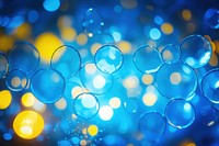 Neon yellow and blue light pattern bokeh effect background backgrounds abstract shape.