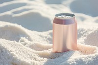 Drink can partially buried in white sand refreshment relaxation sunlight.