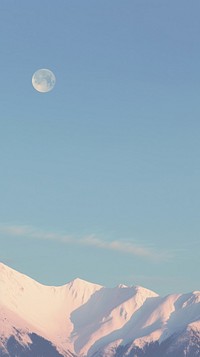 Aesthetic snow covered mountains and one moon and large blue sky landscape wallpaper astronomy outdoors nature.
