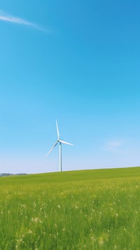 Aesthetic Wind turbine in green field and large blue sky landscape wallpaper outdoors windmill horizon.