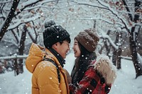 Happy korean couple snow outdoors nature. AI generated Image by rawpixel.