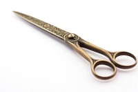 Old vintage tailor or seamstress scissors white background weaponry dagger. 