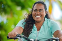 Samoan woman outdoors bicycle vehicle.