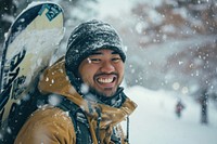 Samoan man outdoors snow snowboarding.