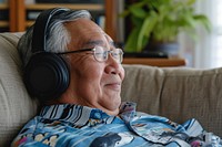 Senior asian man headphones headset glasses.
