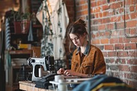 Woman fashion designer machine making sewing.