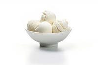 A cup of icecream balls dessert white food.