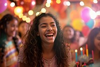 Hispanic teenager girl laughing birthday festival.