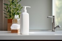 Shampoo bottle with white lable sink bathroom bathroom sink.