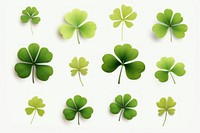 A collection of stylized clover leaves backgrounds plant green.