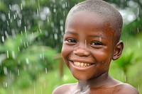 African boy happy with rain smile outdoors happiness.