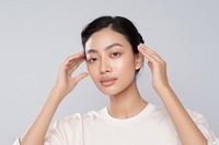 Young beautiful asian woman in skincare and beauty routine portrait adult contemplation.